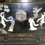 Black lacquered Chinese buffet with stone and ivory figures