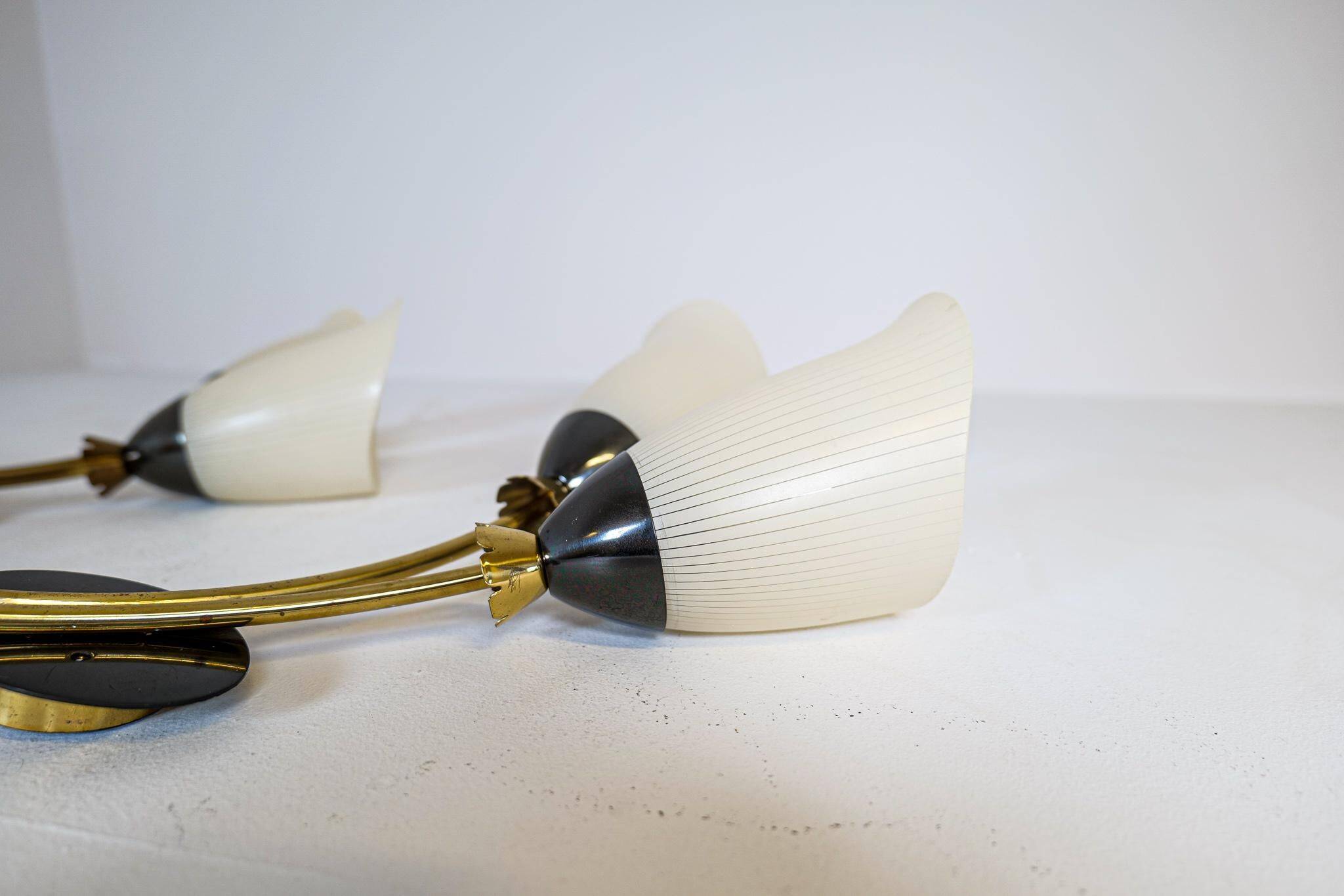 Mid-century pair of wall lamps in brass and opaline attributed to Asea Sweden, 1950s.