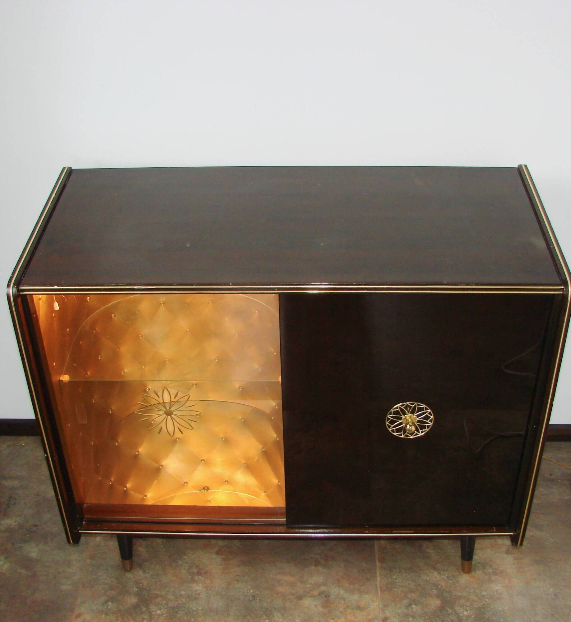 A vintage cabinet with a record player and a bar, 1960s.