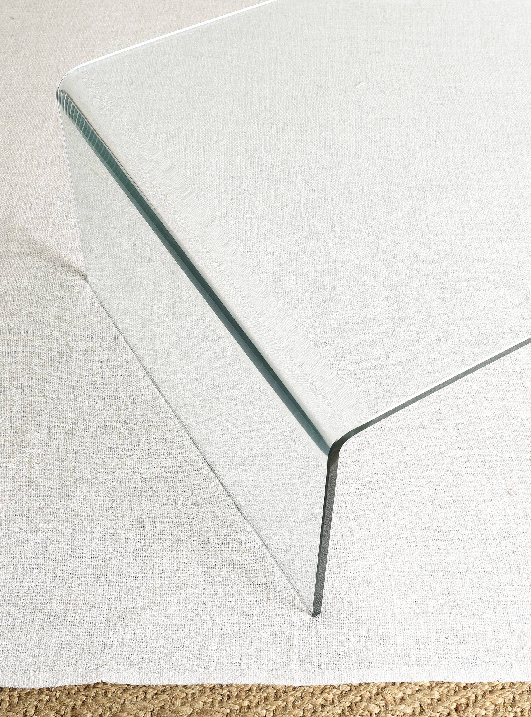 Transparent tempered glass coffee table.