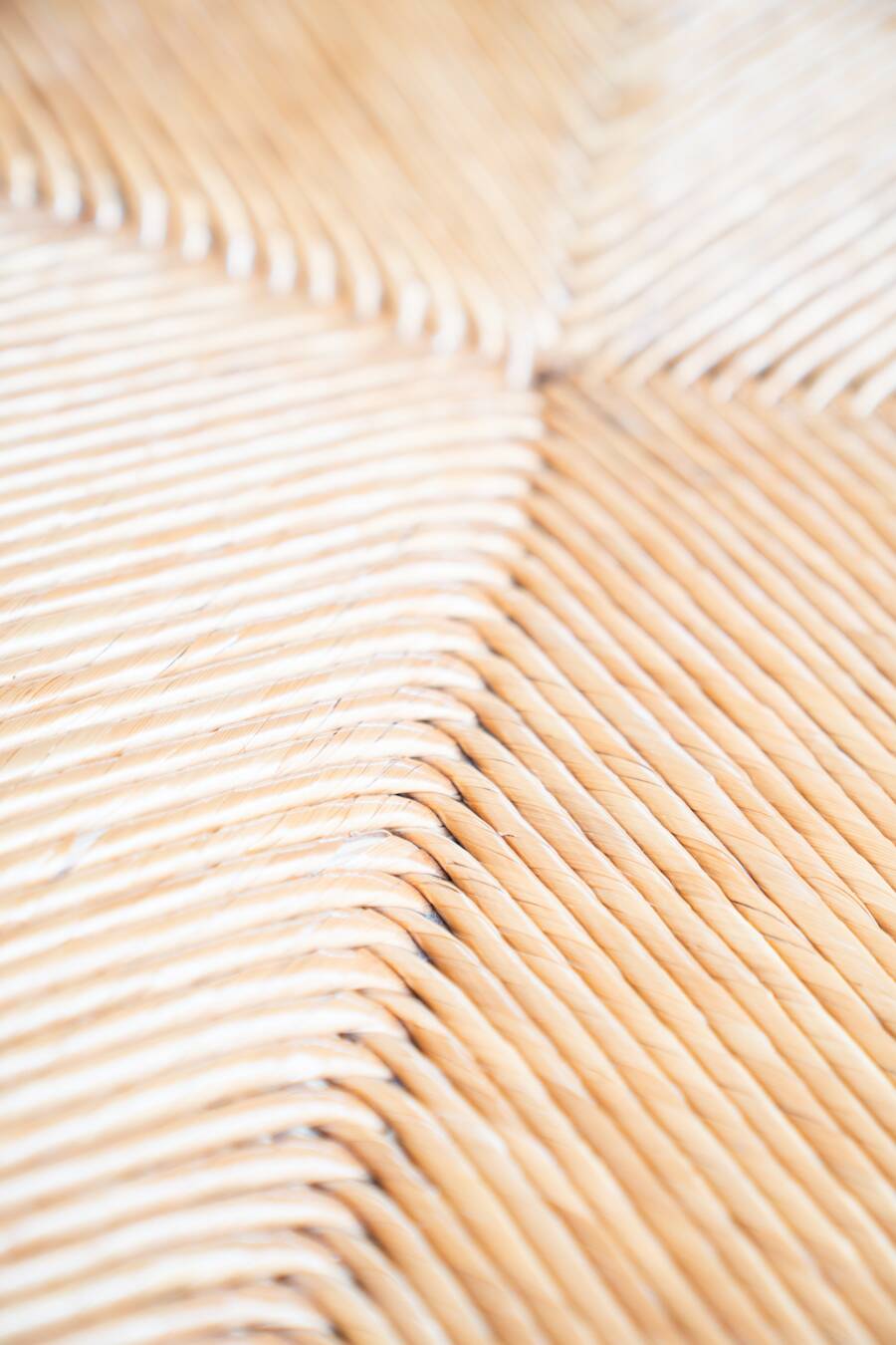 2 low bedroom chairs in hand-woven rice straw, 1950s/1960s