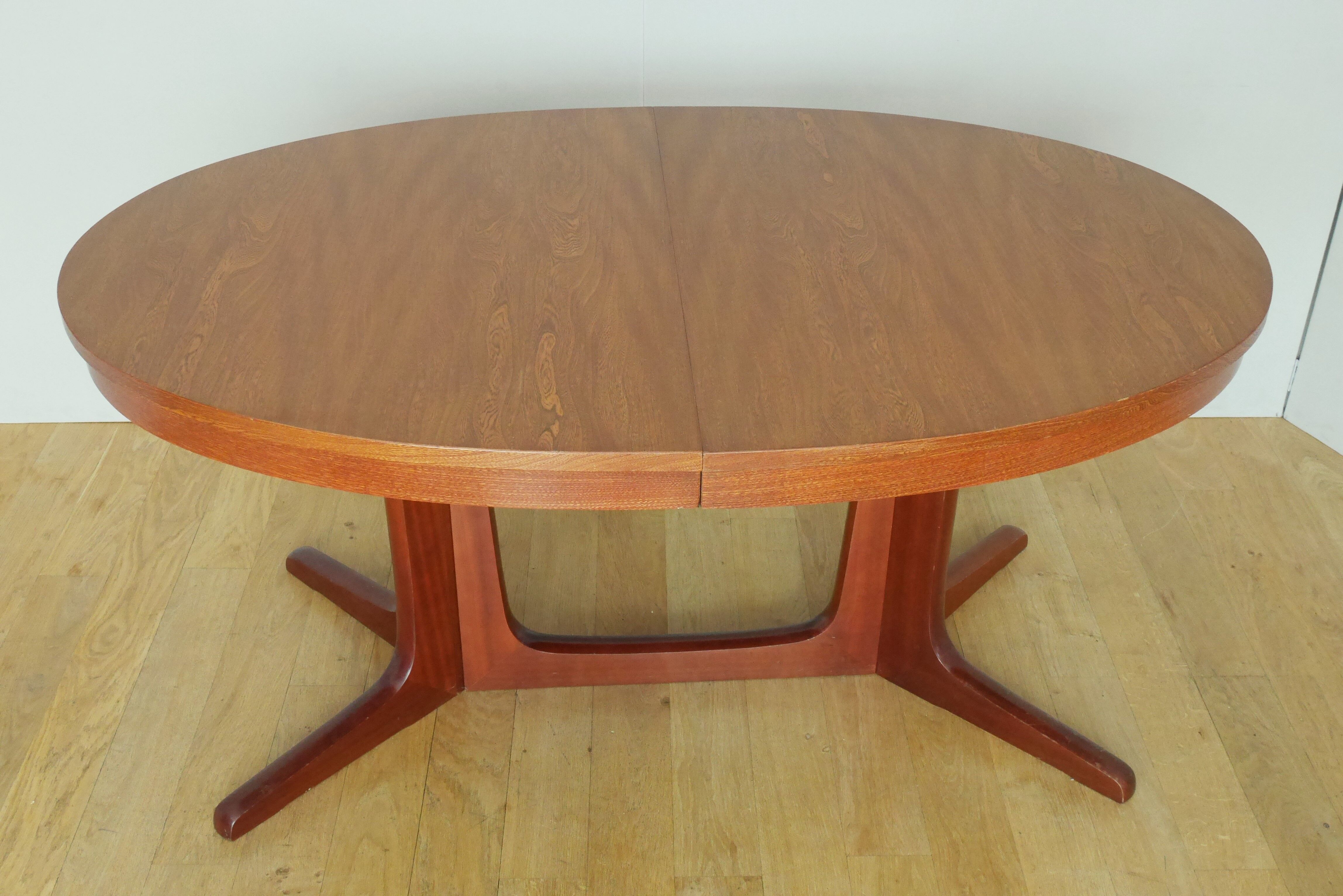 Scandinavian style oval table in central foot with extensions