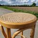 High bar stool in curved wood and cane