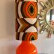 Orange opaline table lamp and vintage fabric