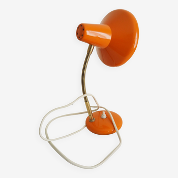 Orange colored metal desk lamp from the 1960s-1970s
