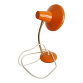 Orange colored metal desk lamp from the 1960s-1970s
