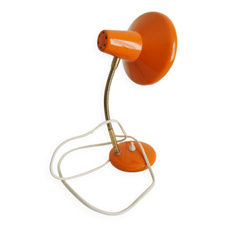 Orange colored metal desk lamp from the 1960s-1970s