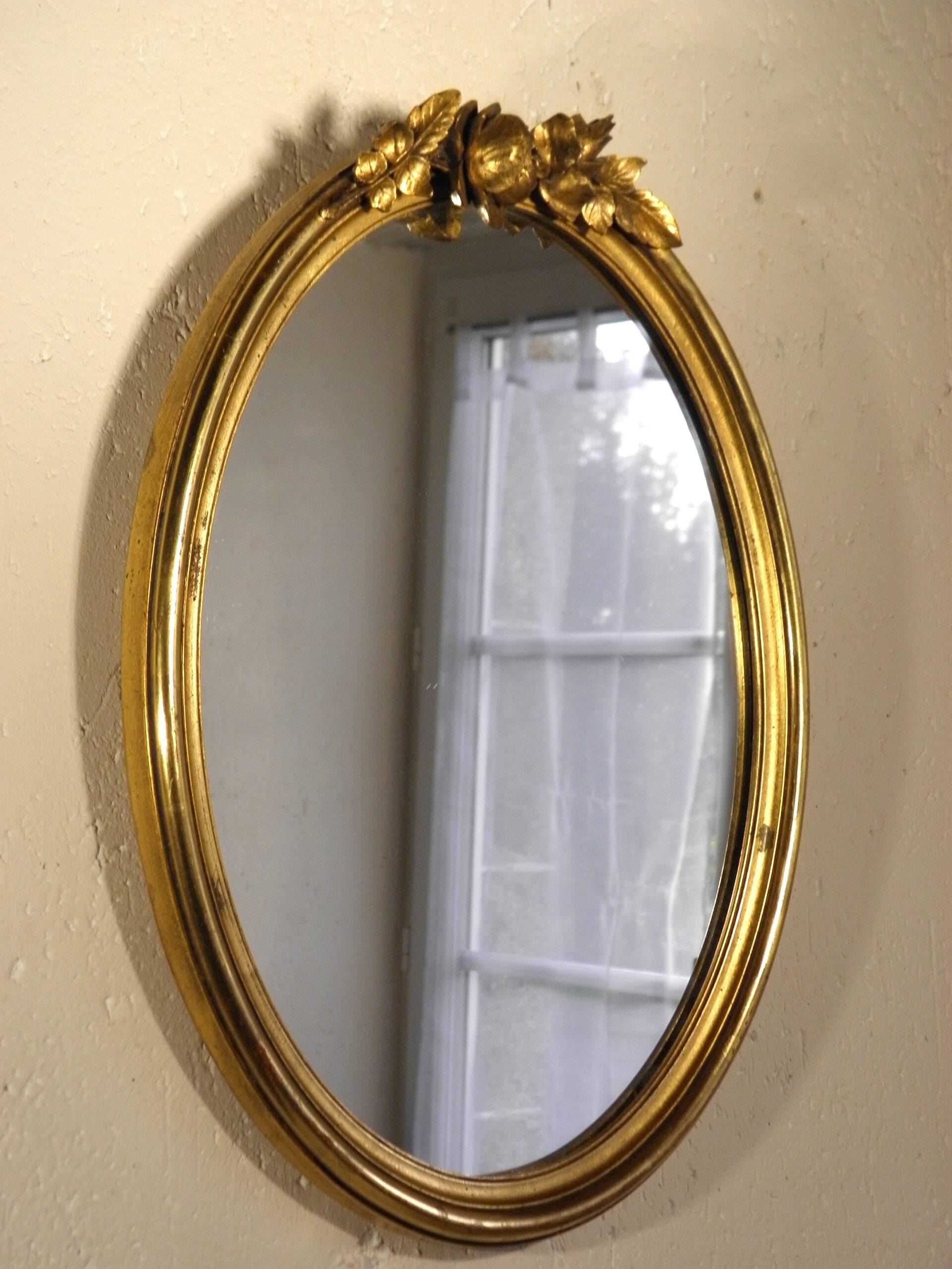 Oval gilded wood mirror 45 x 34