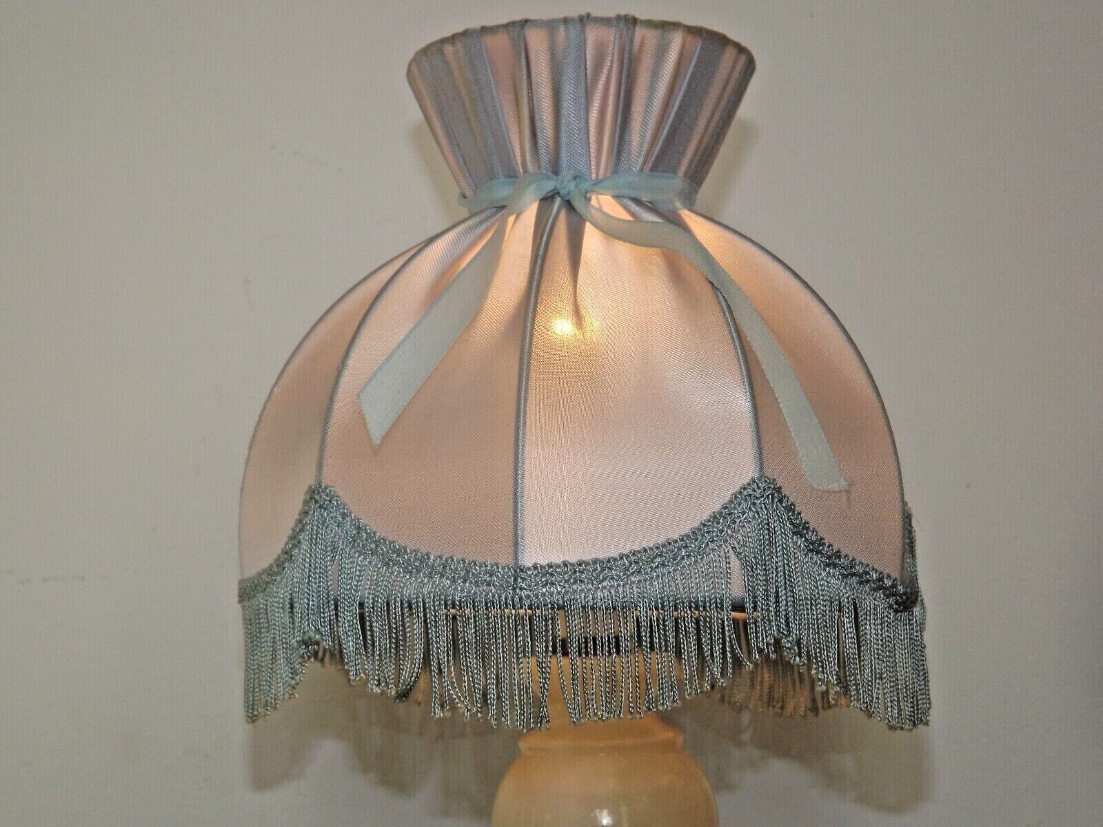 Pair of marble bedside lamps with blue satin fringed shades