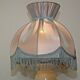 Pair of marble bedside lamps with blue satin fringed shades