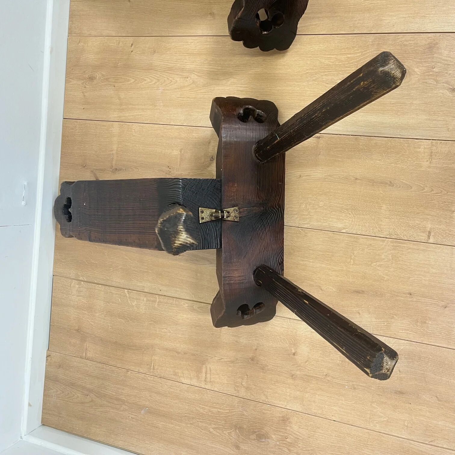 Pair of low tripod chairs in solid wood, mid-20th century.