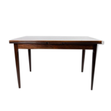 Dining table in rosewood with extentions, of danish design from the 1960s.