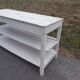 Antique white patinated draper's table, florist's wooden console.