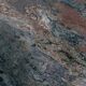Dining table in solid Juparana granite