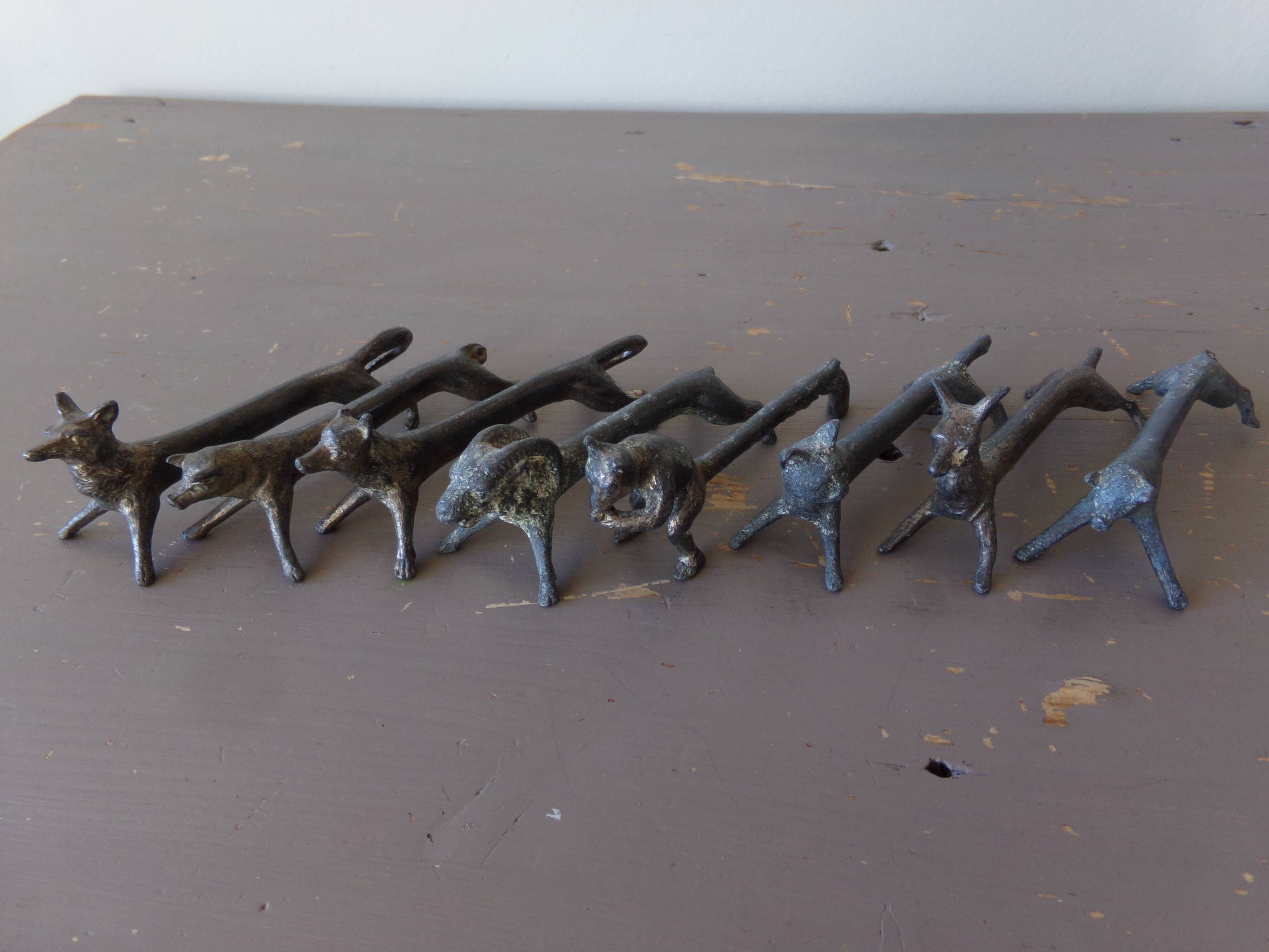 8 antique tin animal knife holders