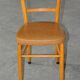 Vintage chair in brown faux leather and light wood, 1960s, padded seat.