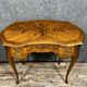 Louis XV style dressing table in "kidney" shape in rosewood decorated with marquetry flowers