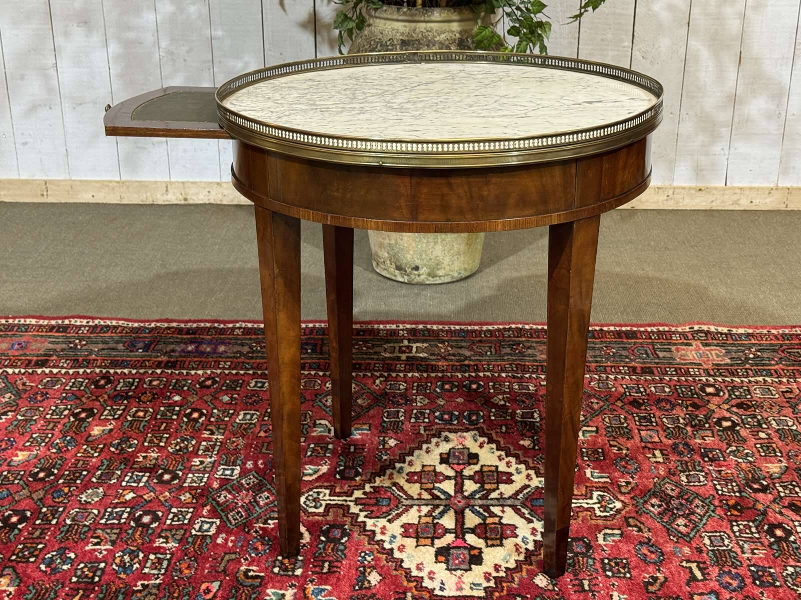 Louis XVI style bouillotte table in mahogany with a white marble top.