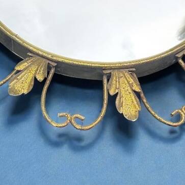 Circular gold metal mirror with floral decoration – 1960s