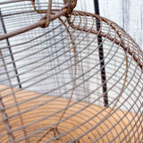 Old basket has wire eggs