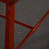 Pair of patinated wooden stools painted red with flared legs, 1950s-1960s.