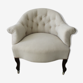 Fauteuil de style capitonné