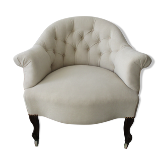 Fauteuil de style capitonné