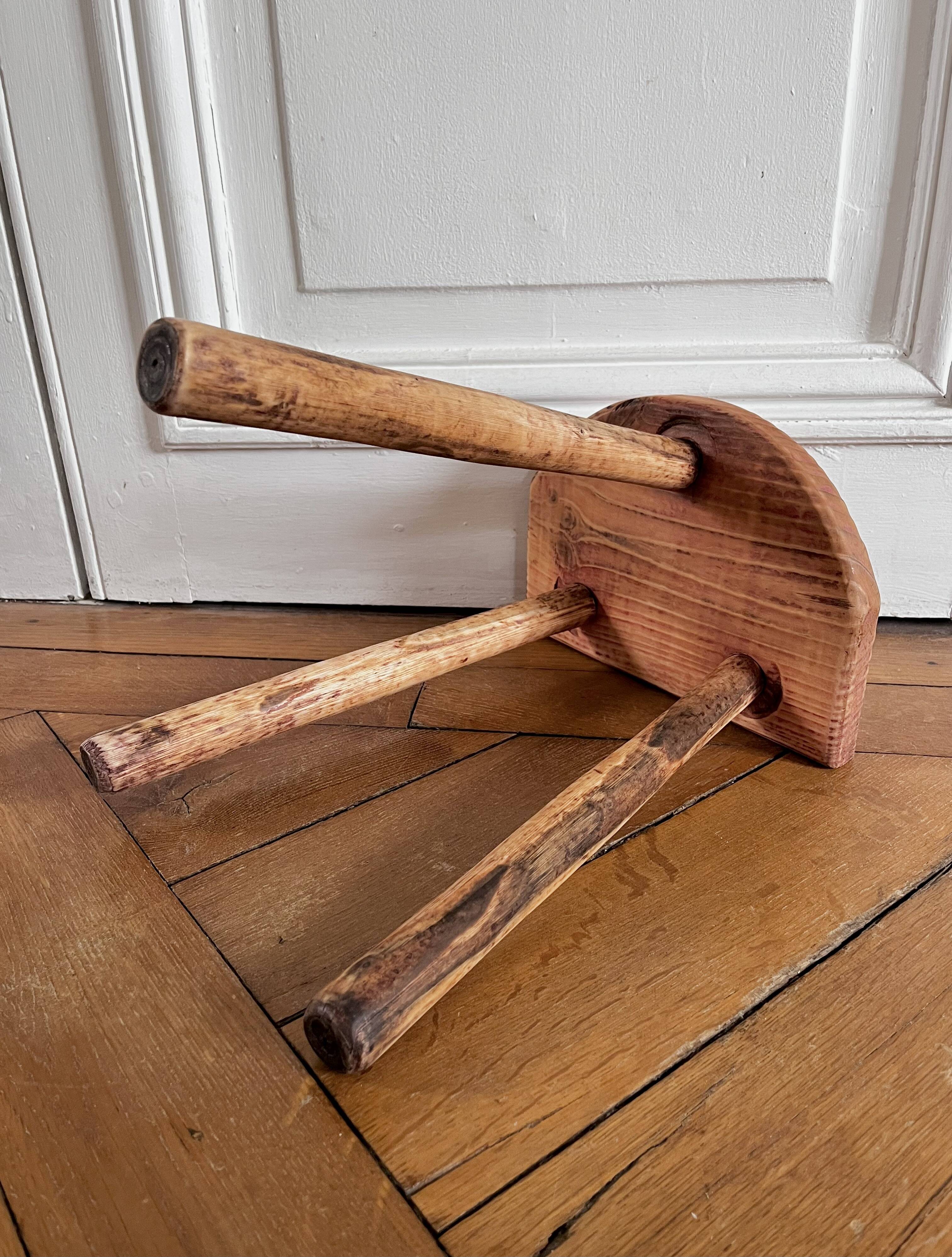 Tripod stool in raw wood