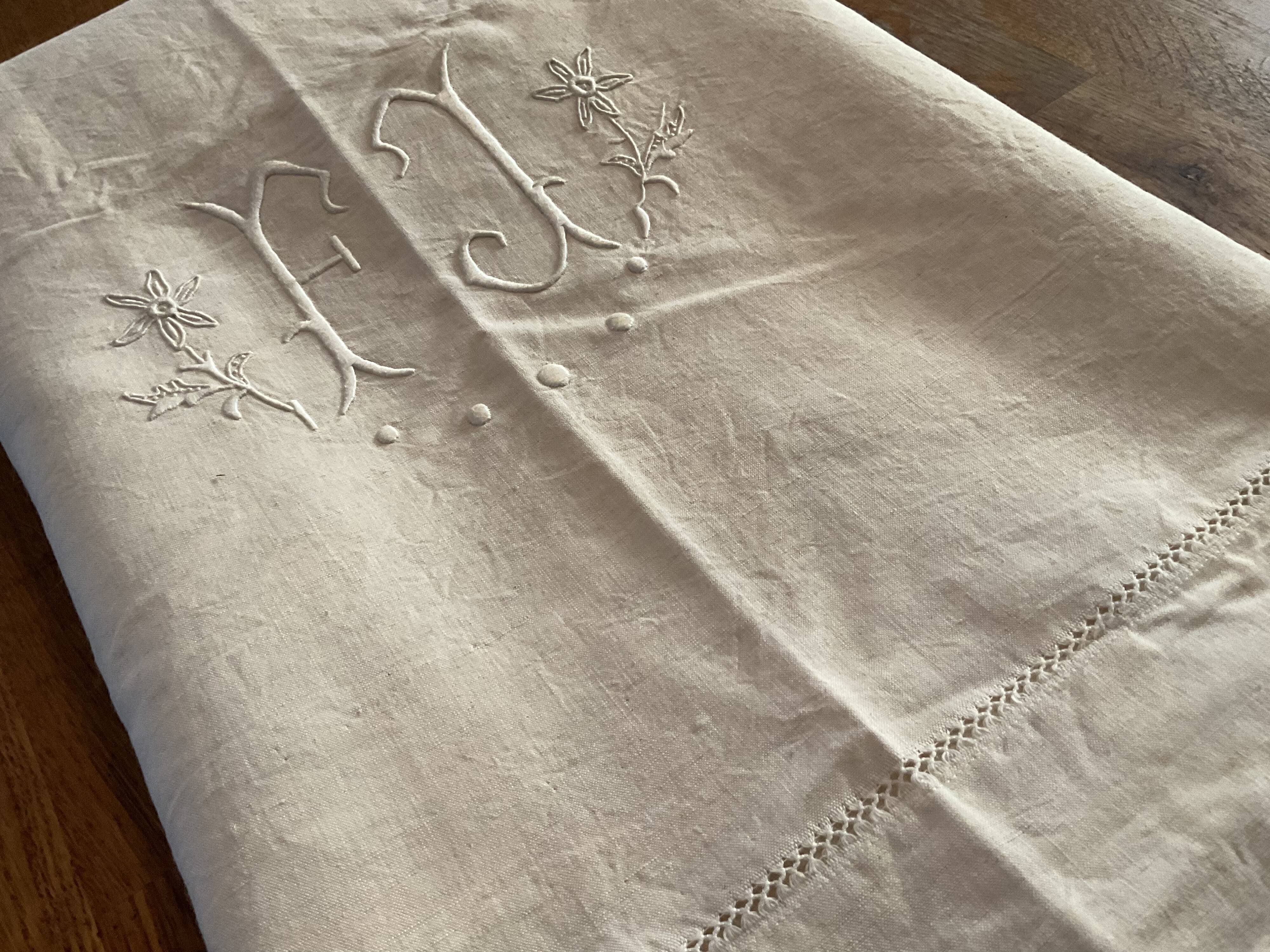 Old embroidered sheet, monogram F J