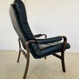 Vintage mid-century Scandinavian black leather lounge chair 1970s