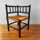Antique corner chair made of turned wood.