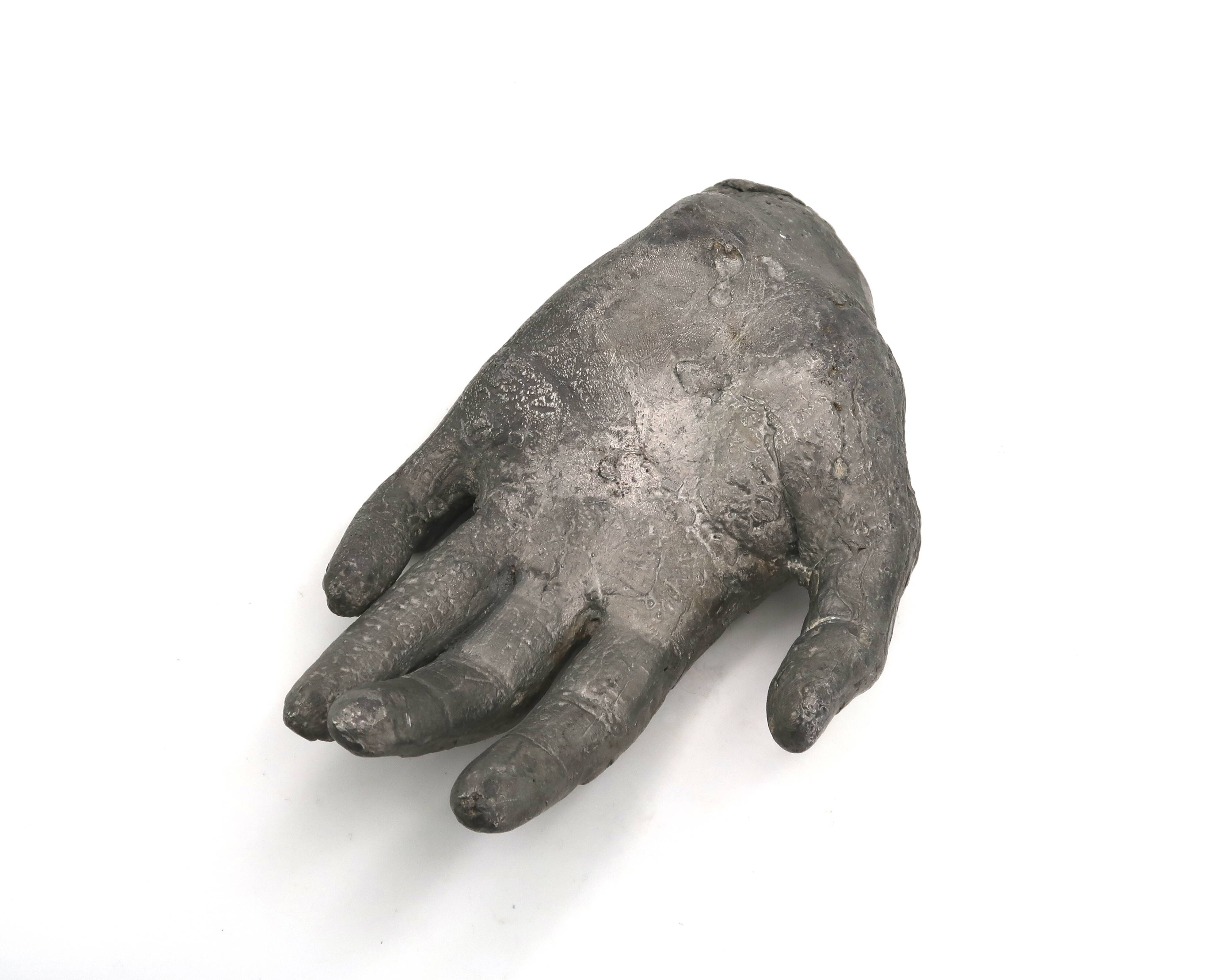 Cast iron silver-coloured catchall in the shape of a hand, 1970s sculpture.