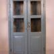 Old art deco display case in original Burmese teak with gray-blue patina