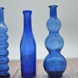 Set of 4 blue bottles of decoration