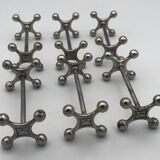 Set of 6 old table knife resistors in the shape of crossbars in silver metal
