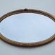 Miroir ovale en bois doré, style Louis XVI