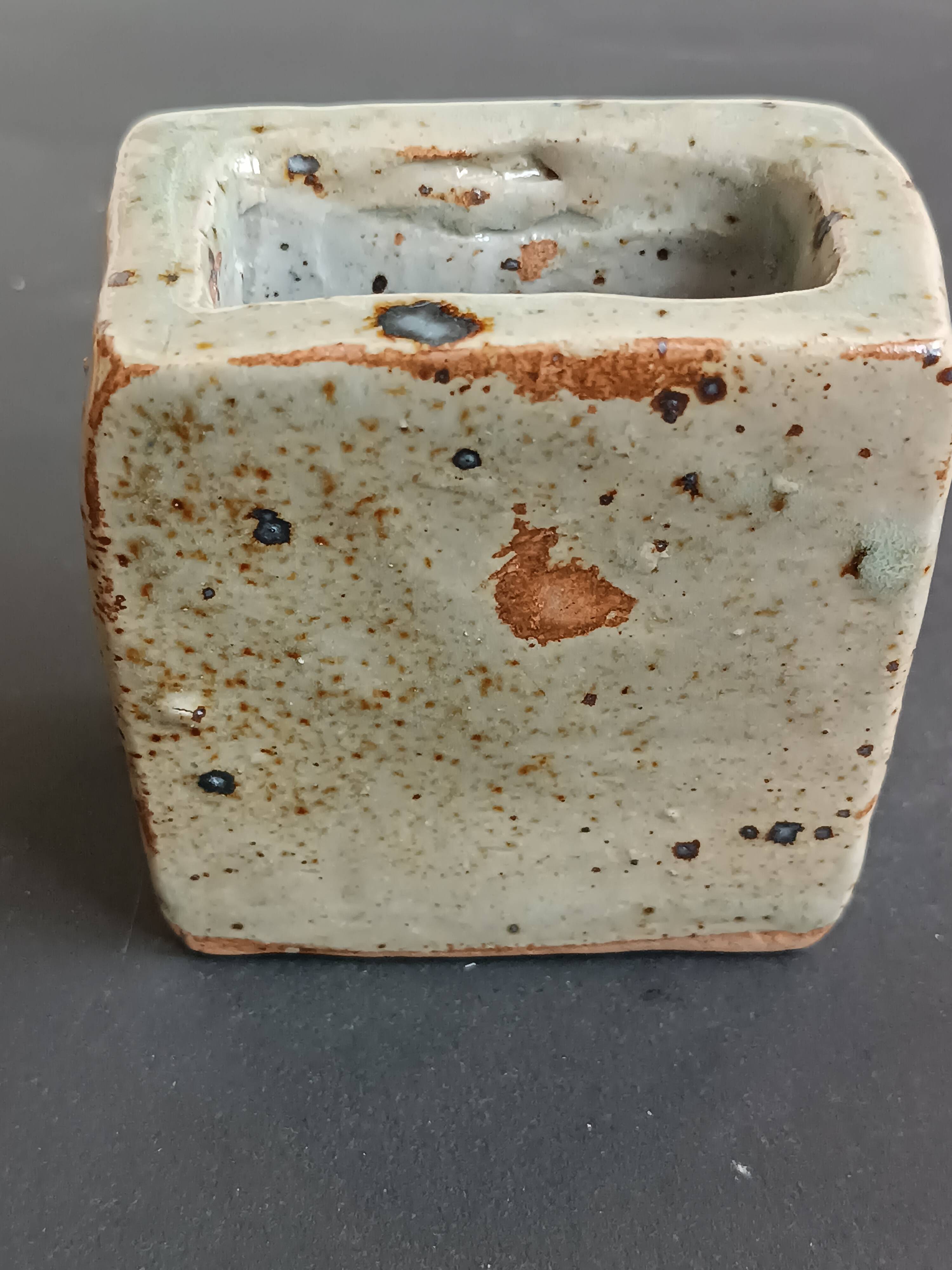 Pyrite stone vase with blue thistle decoration by Suzanne Dauliach, vintage.