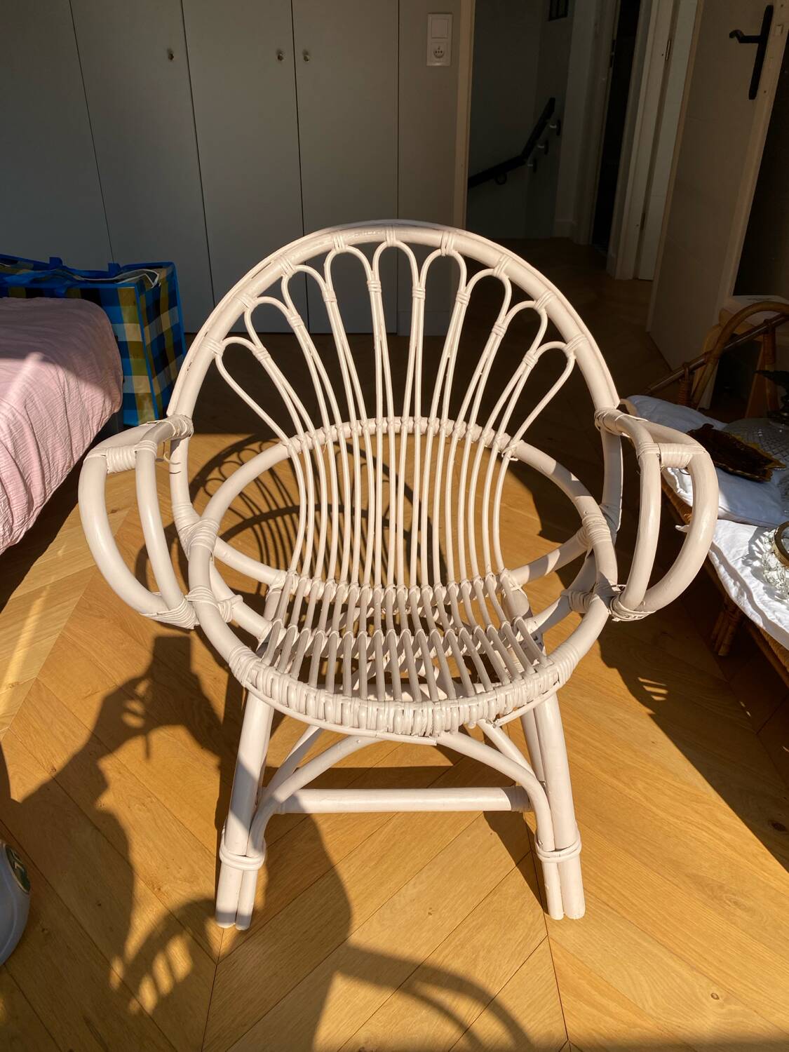 Shell chair in pale pink painted rattan
