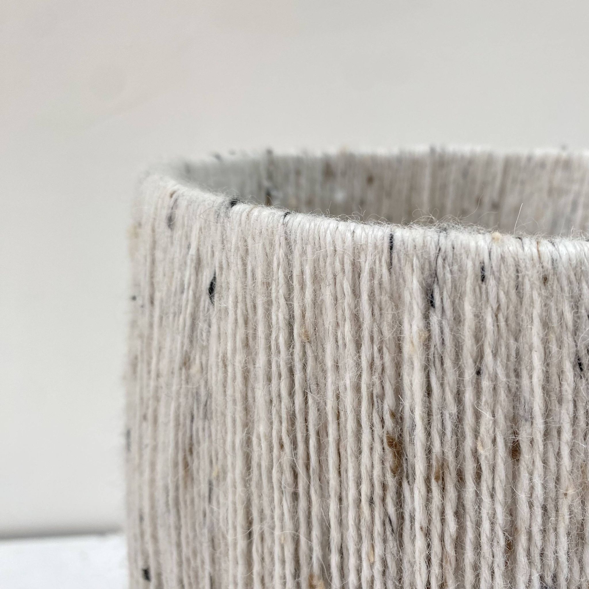 Rattan lamp and its mottled white wool lampshade