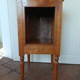 Open wooden bedside table