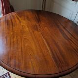 Round mahogany table with extensions