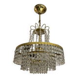 Cascade chandelier with crystal and brass tassels