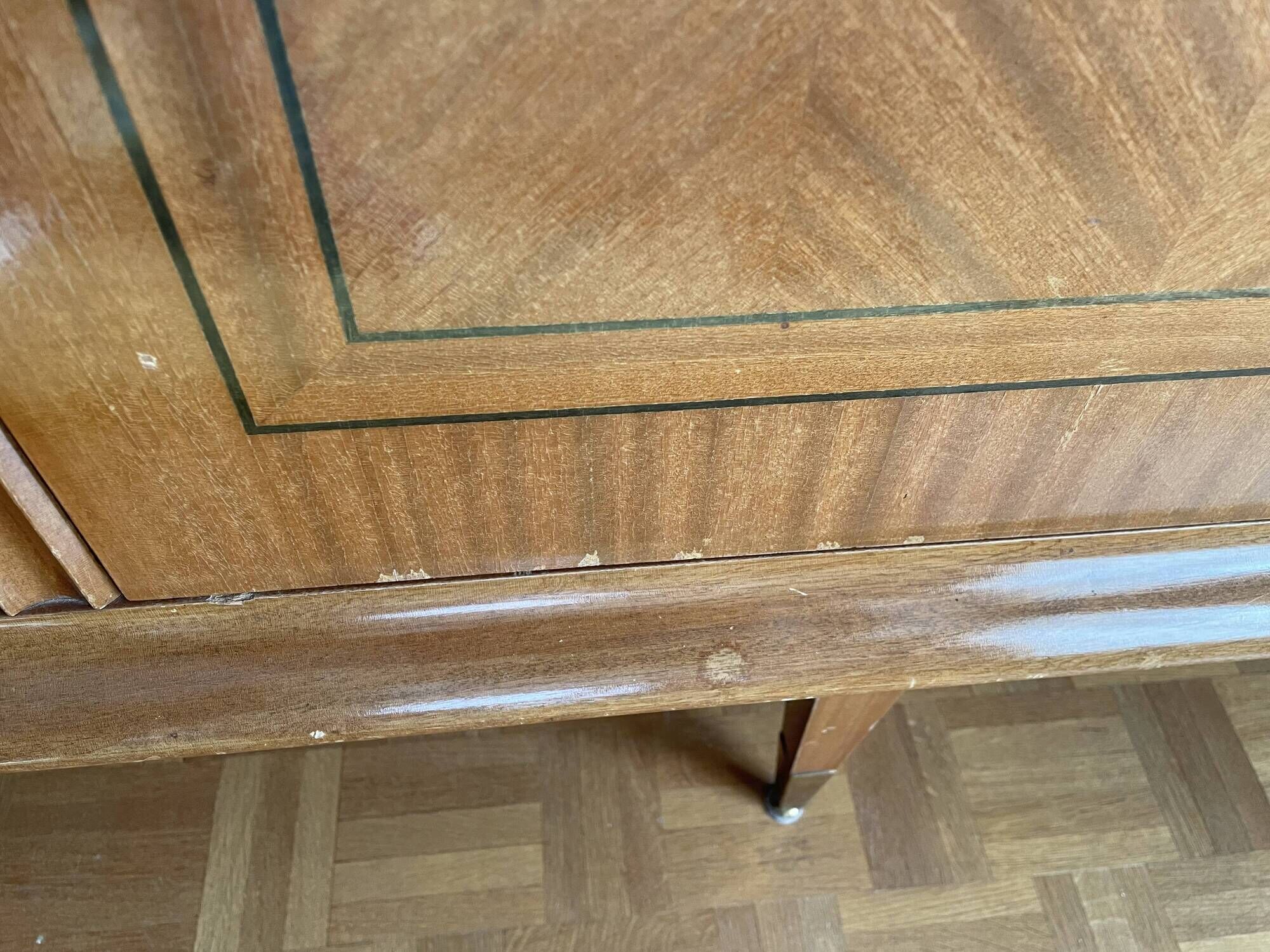 Vintage 4-door buffet with wood veneer and glass top.