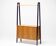 Italian 1950s teak and black lacquered separator with diamond-patterned doors.