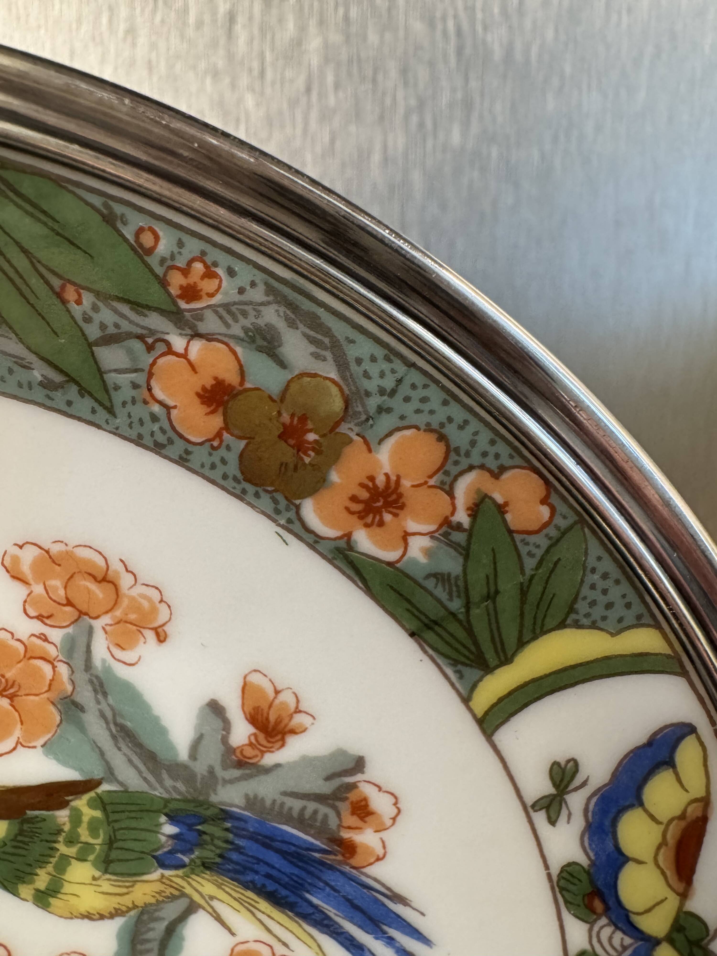 Two Raynaud Limoges plates and Tetard brothers silver.