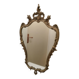 Miroir mural avec ornements dores patine
