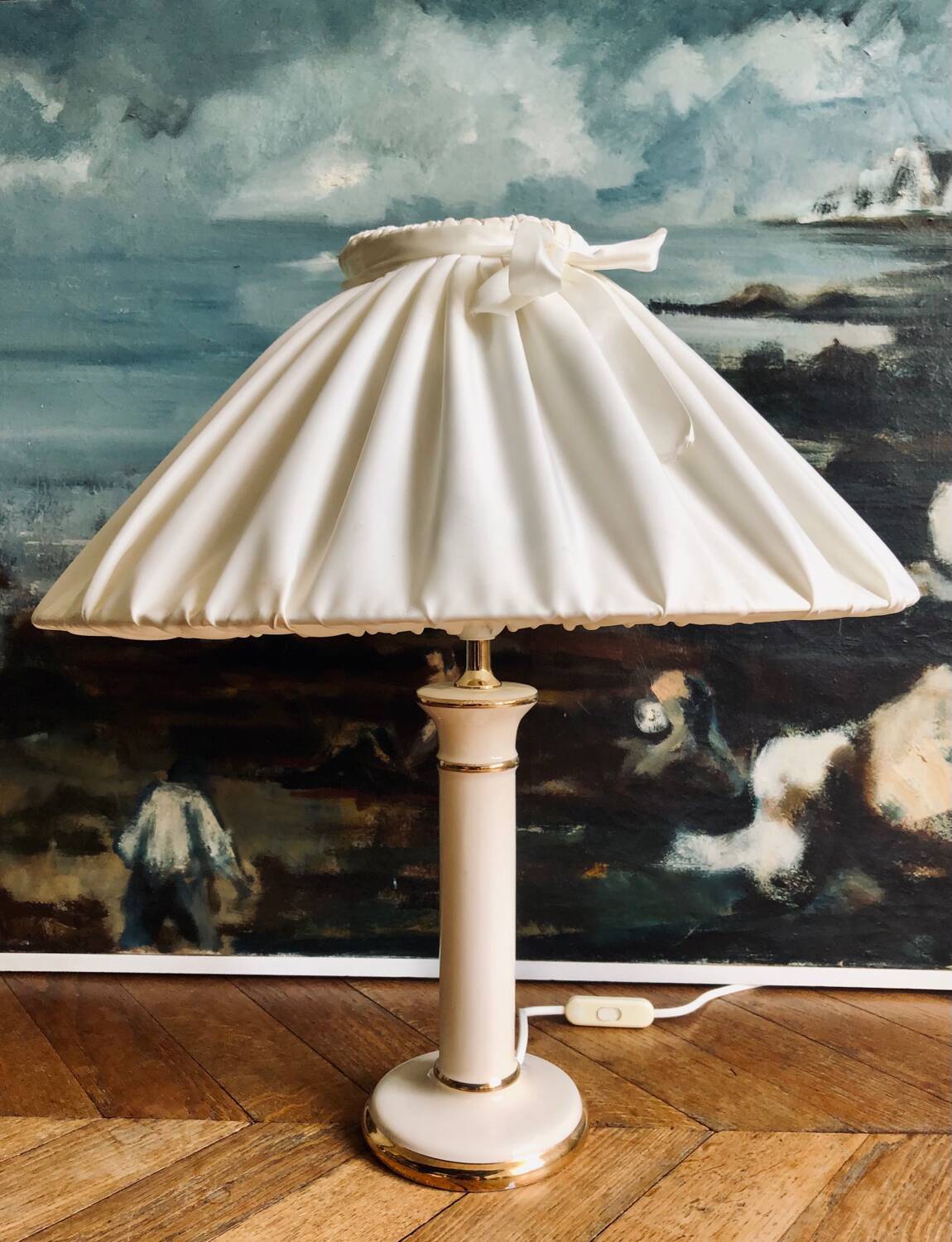 Vintage ivory ceramic lamp with gilding.