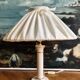 Vintage ivory ceramic lamp with gilding.