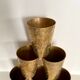 Six chiseled metal glasses