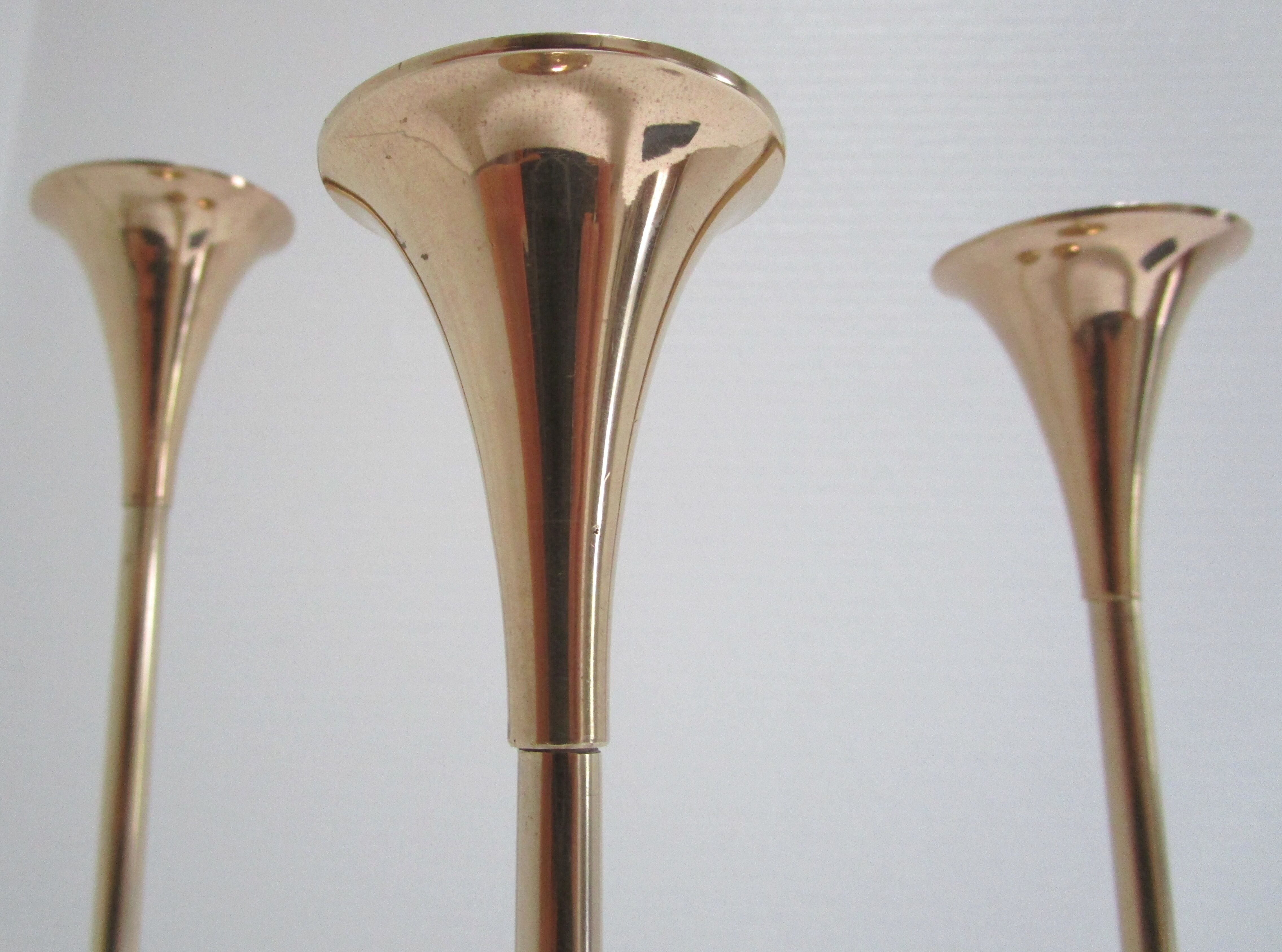 Trio of brass scandinavian candlesticks